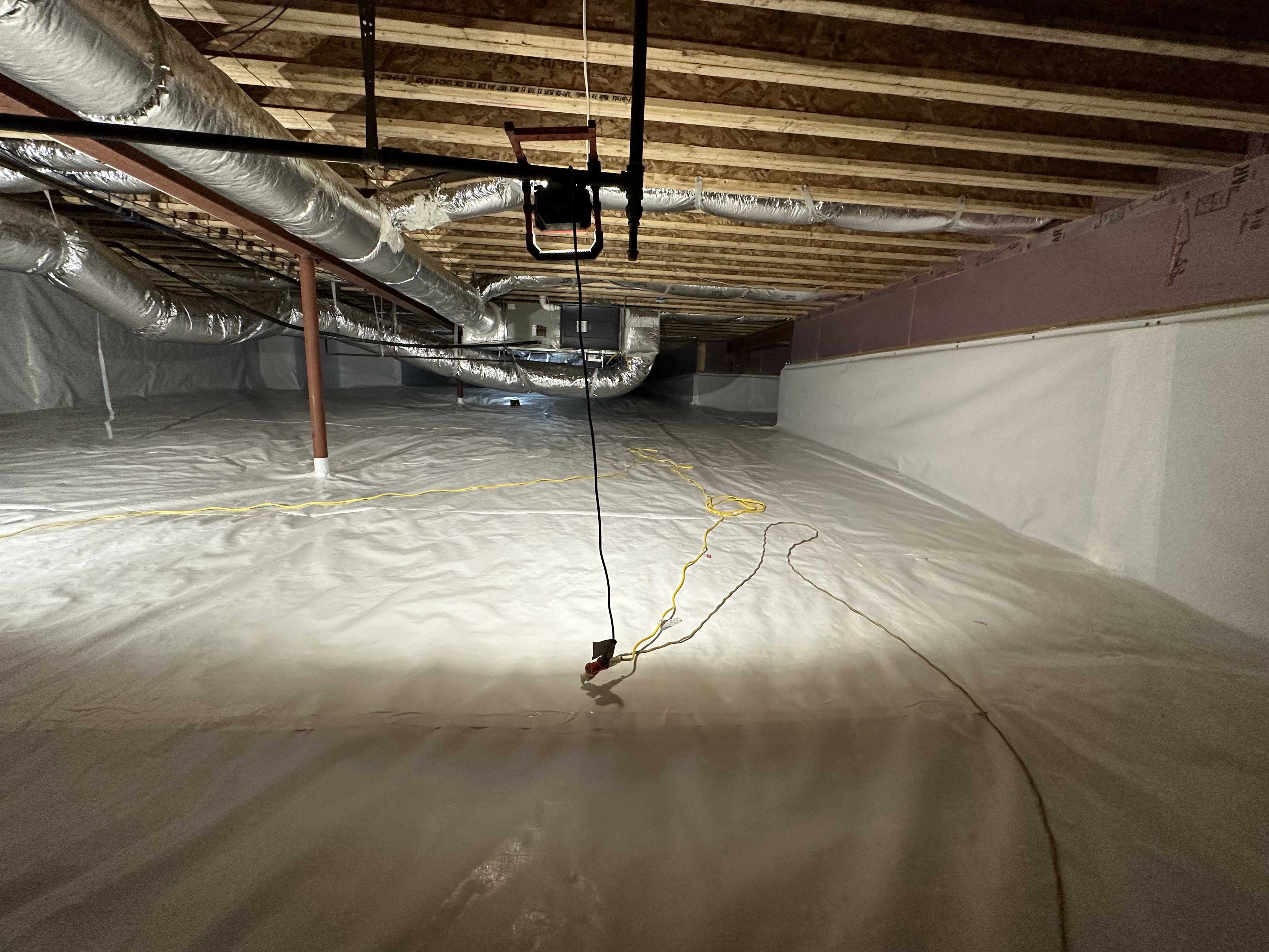 Encapsulated crawlspace with HVAC flex duct and white vapor barrier floor, Chattanooga Tennessee