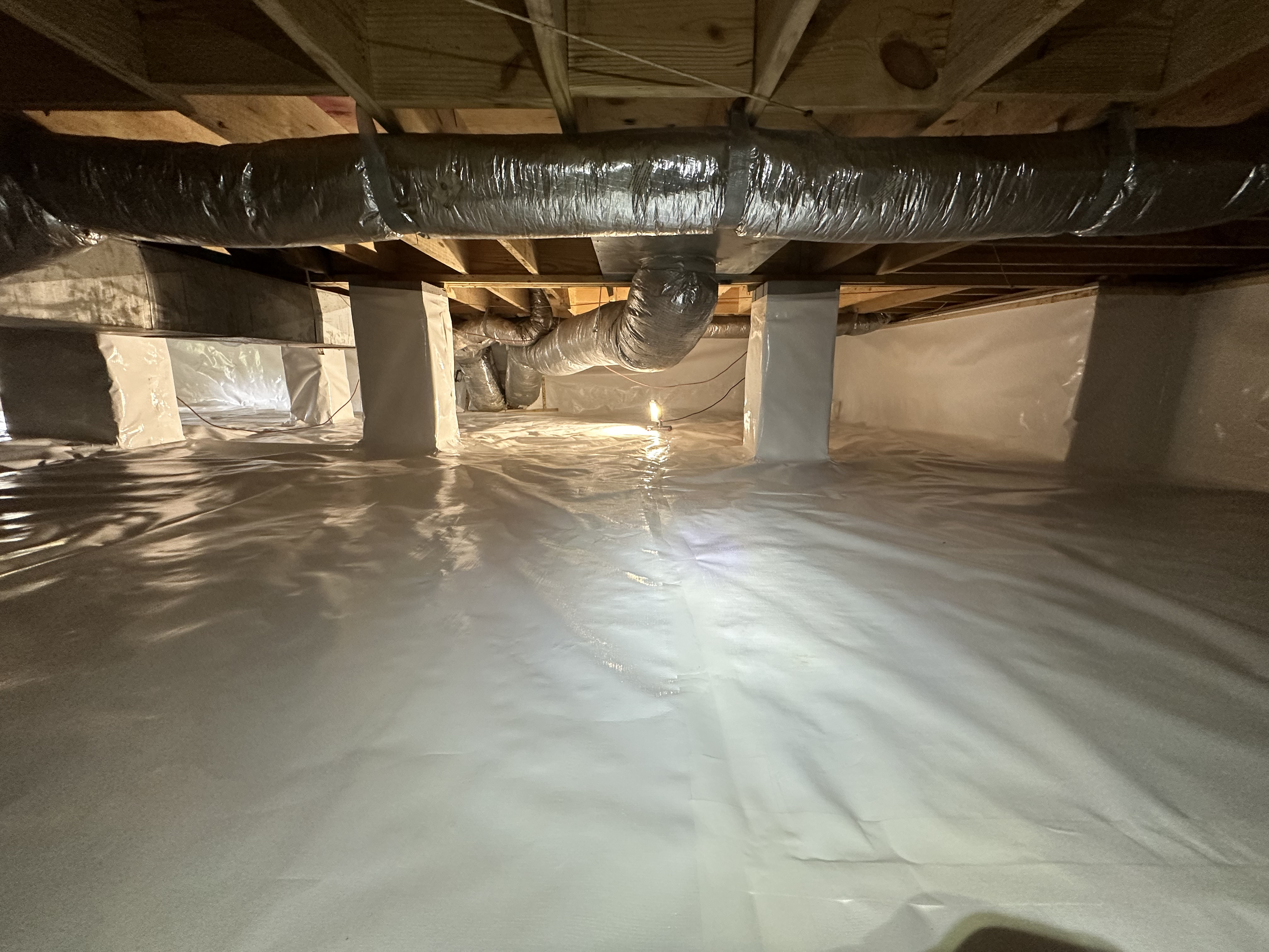 Commercial-scale crawlspace encapsulation with multiple wrapped concrete support columns, Chattanooga TN