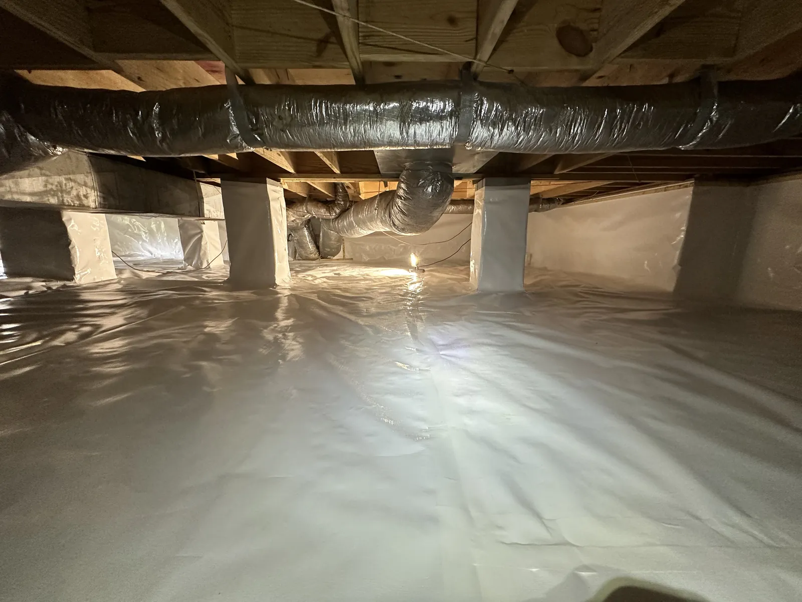 Commercial-scale crawlspace encapsulation with multiple wrapped concrete support columns, Chattanooga TN
