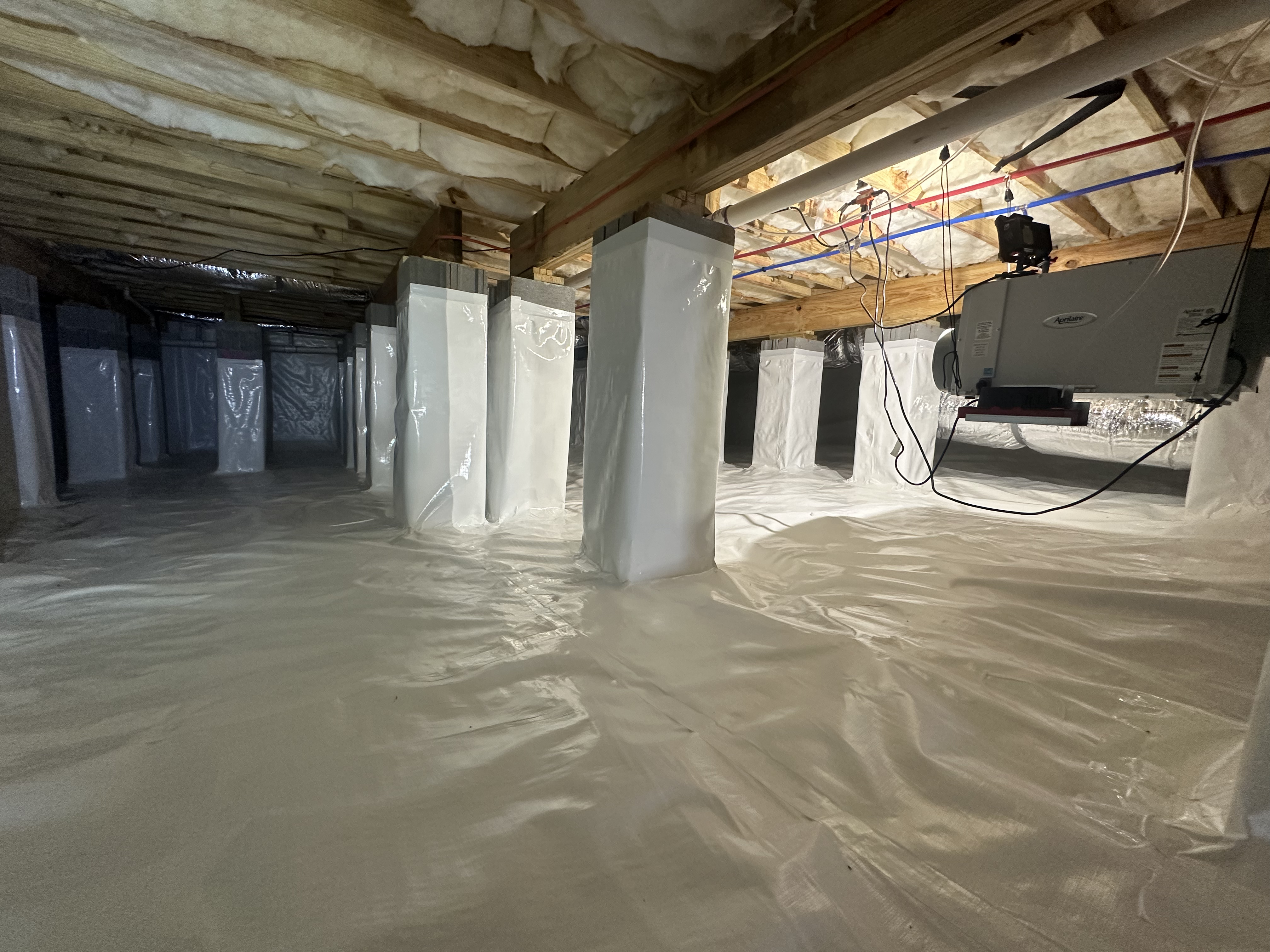 Finished crawlspace encapsulation with white vapor barrier and HVAC air handler unit, Chattanooga Tennessee