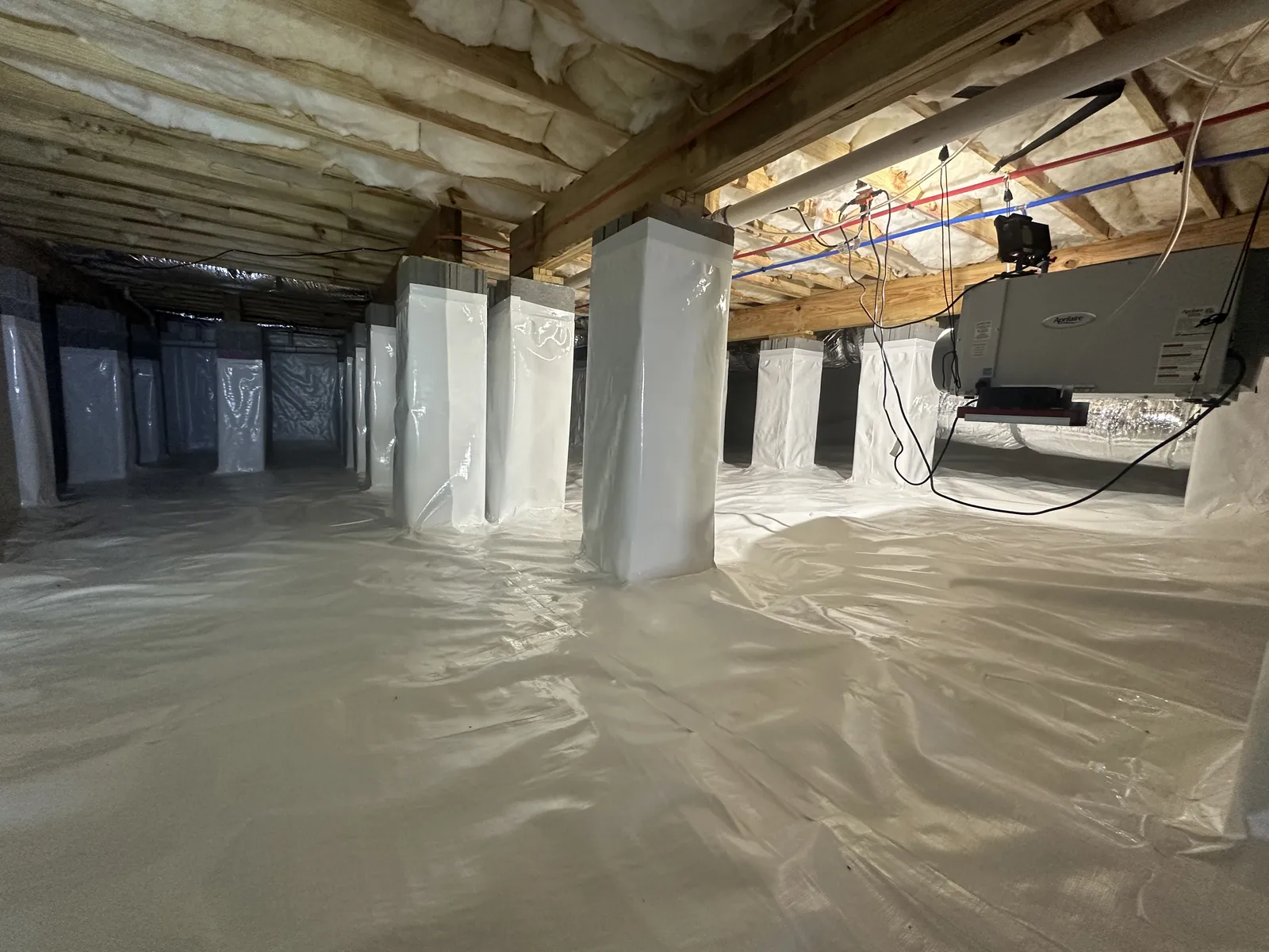 Finished crawlspace encapsulation with white vapor barrier and HVAC air handler unit, Chattanooga Tennessee